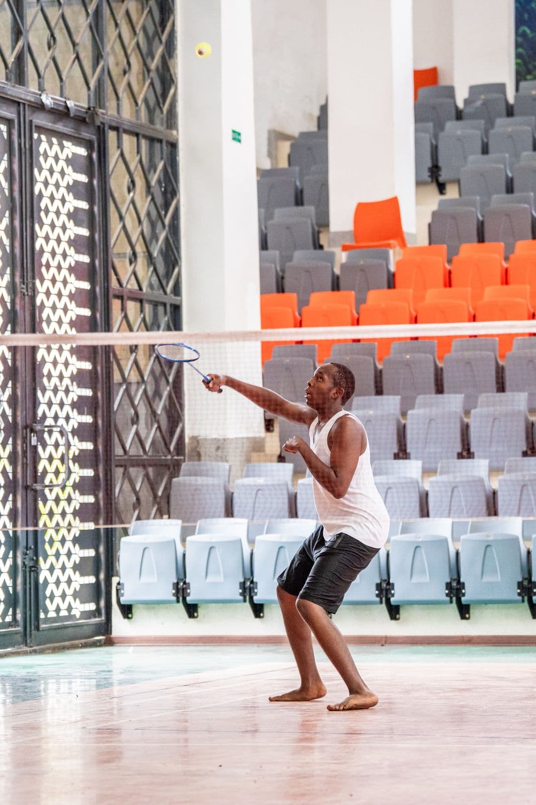 Merishaw School student playing badminton on the indoor court