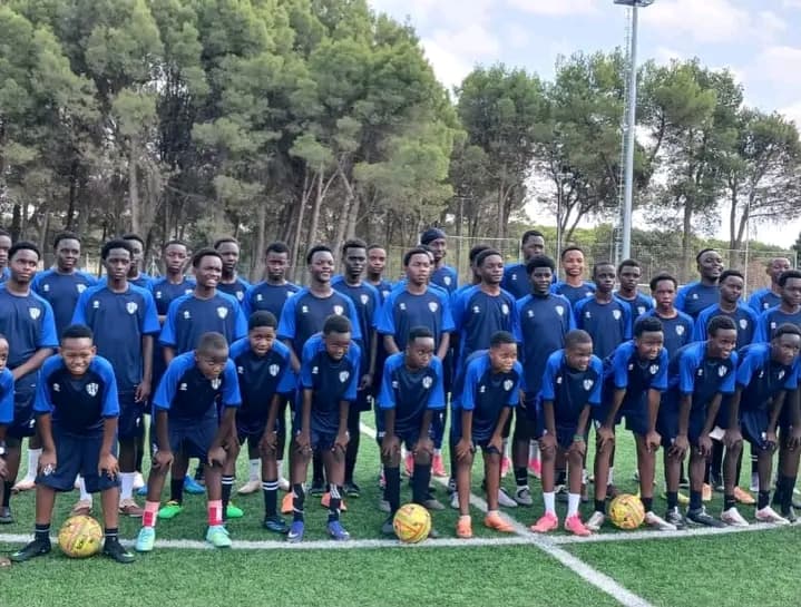 The Merishaw Morans squad line up on the Madrid training pitch
