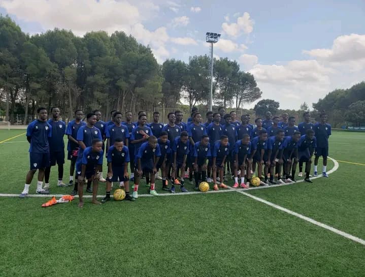 The Merishaw Morans and their coaches on the pitch at the Madrid football experience