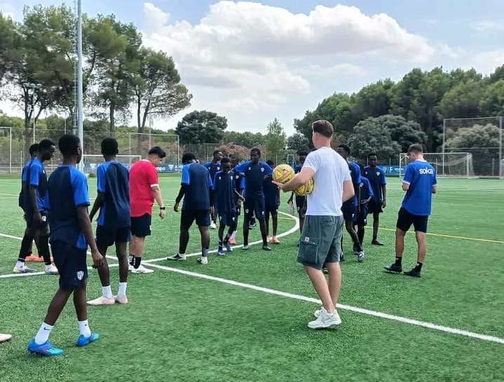 The Morans training under an elite coach during their Madrid football experience