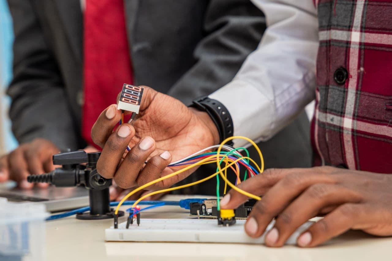 Merishaw School student testing a robotics circuit during a practical STEM activity