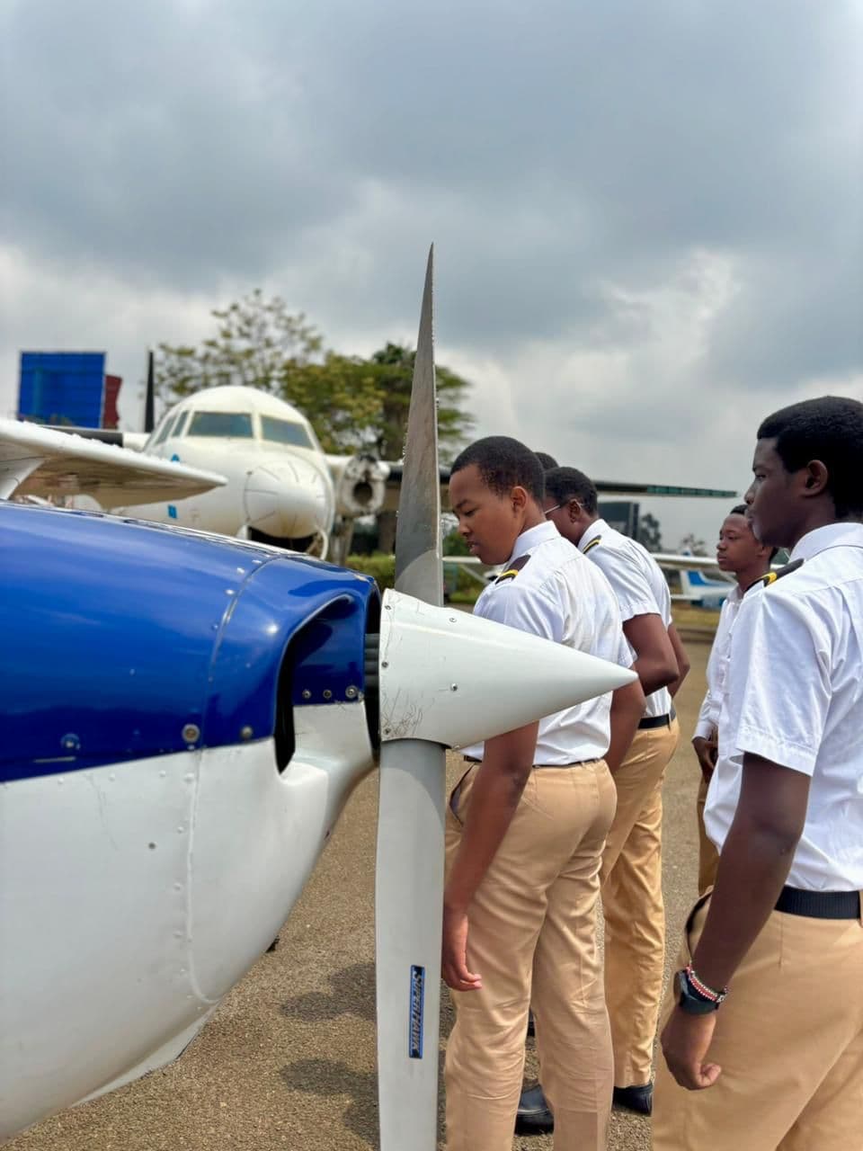 Merishaw School aviation students examining an aircraft propeller