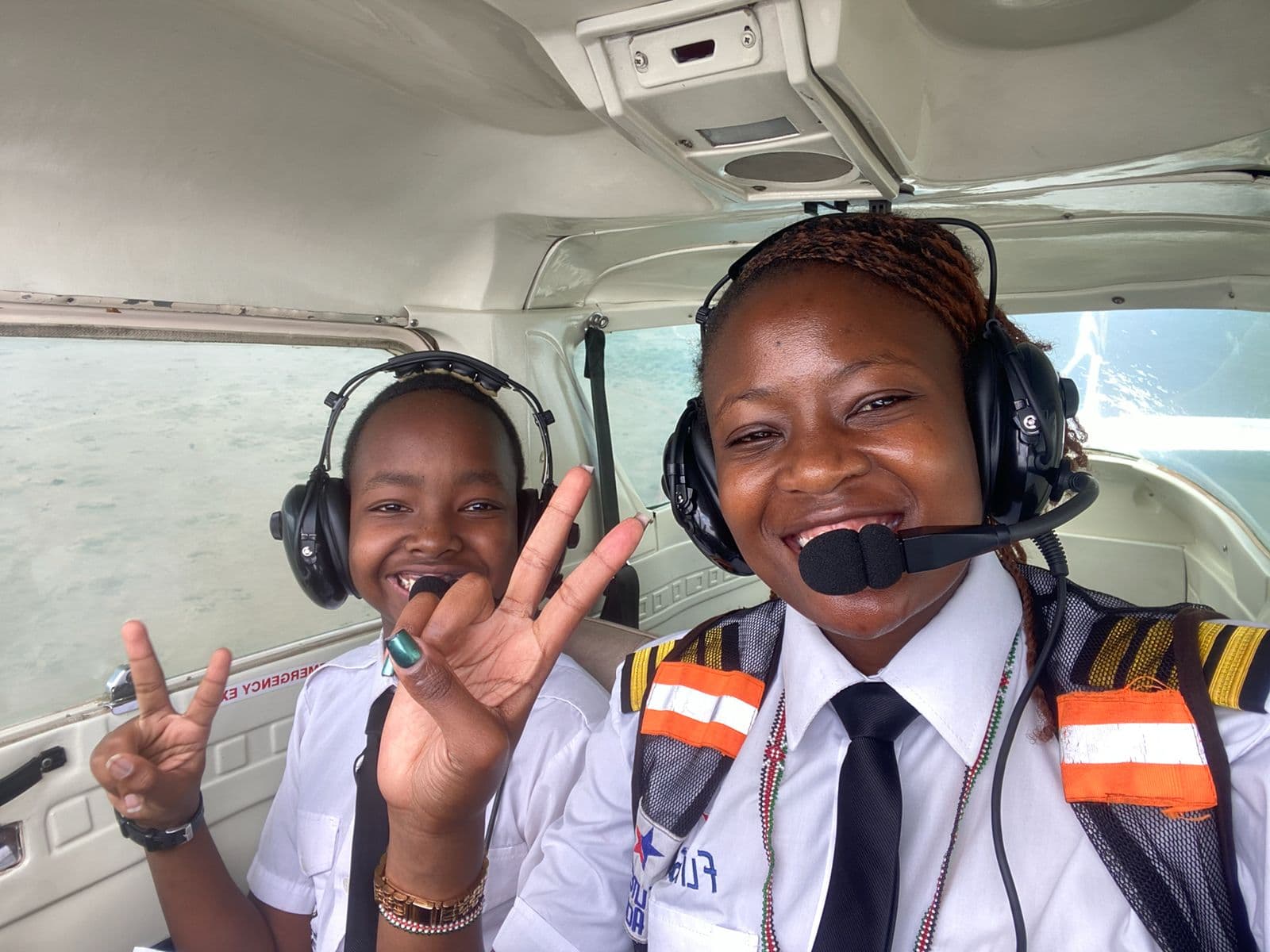 A Merishaw School student and aviation mentor inside an aircraft