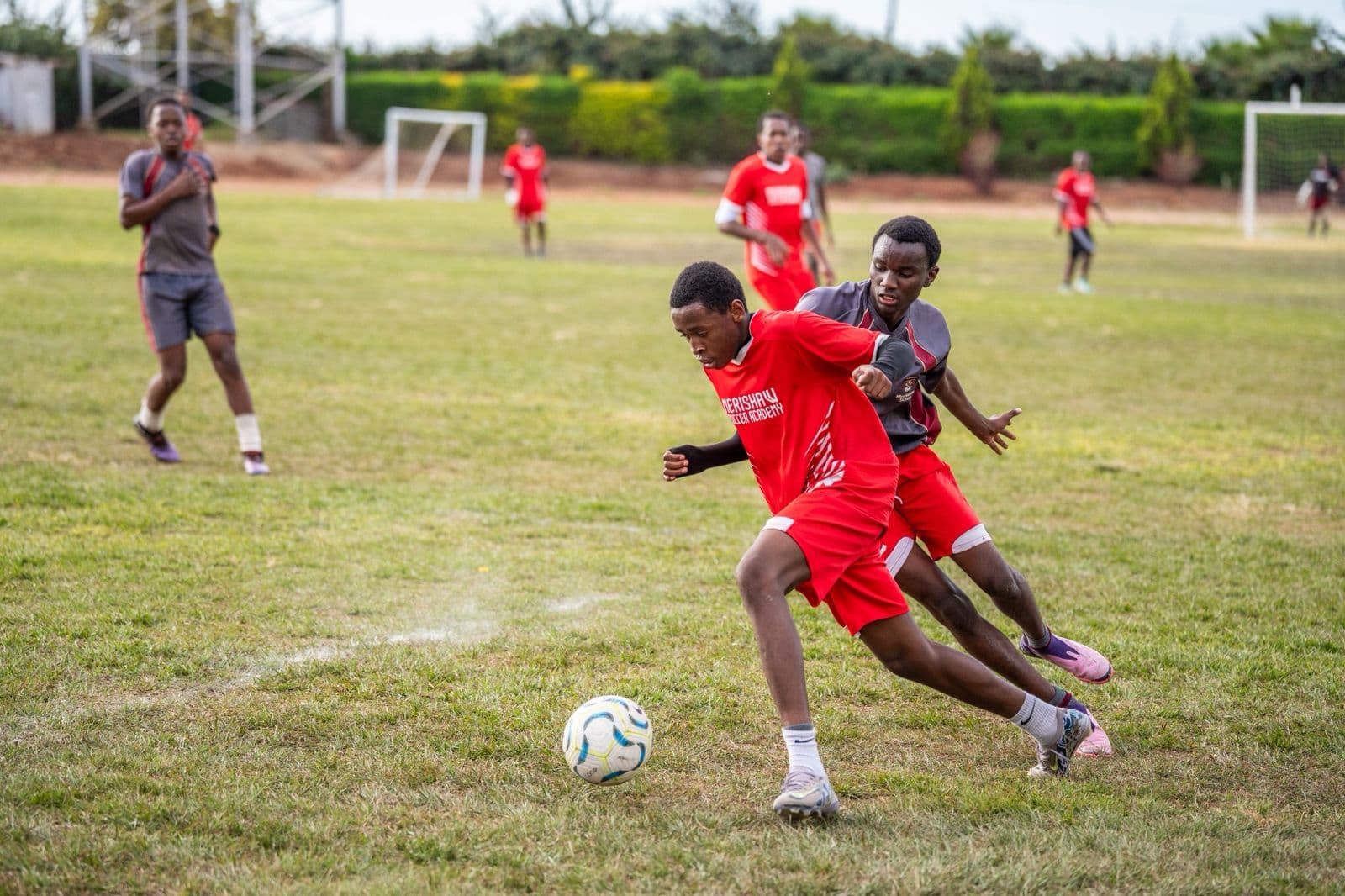 Merishaw Soccer Academy student driving forward with the ball